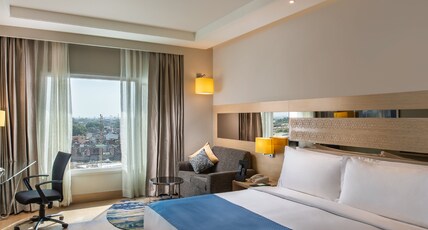 Holiday Inn Agra MG Road Room Type - 1 King Bed Standard-15pct discount on F&B(including in room dining),laundry,ironing Holiday Inn Agra MG Road Room Type - 1 King Bed Standard-15pct discount on F&B(including in room dining),laundry,ironing