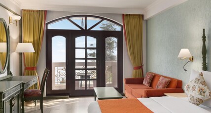 Ramada By Wyndham Mussoorie Mall Road Room Type - Valley View with Balcony & Seating Area Ramada By Wyndham Mussoorie Mall Road Room Type - Valley View with Balcony & Seating Area
