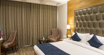 Regenta Central Cassia Zirakpur Chandigarh Room Type - Deluxe Double Room-Enjoy Happy Hours with 1+1 offer on Mocktails and Alcoholic Beverages (Indian-Mad Regenta Central Cassia Zirakpur Chandigarh Room Type - Deluxe Double Room-Enjoy Happy Hours with 1+1 offer on Mocktails and Alcoholic Beverages (Indian-Mad