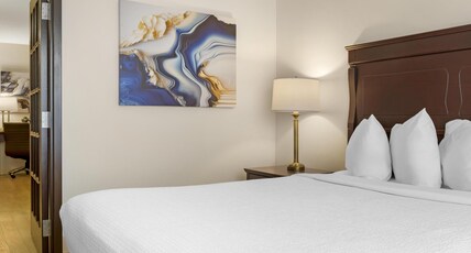 Best Western Plus Grand-Sault Hotel & Suites Room Type - Suite-1 Queen Bed, Non-Smoking, Separate Bedroom, Sofabed, Living Room, French Doors, Microwave And Best Western Plus Grand-Sault Hotel & Suites Room Type - Suite-1 Queen Bed, Non-Smoking, Separate Bedroom, Sofabed, Living Room, French Doors, Microwave And