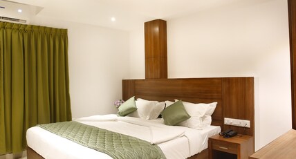 Hotel Navarathna Room Type - Deluxe Room AC