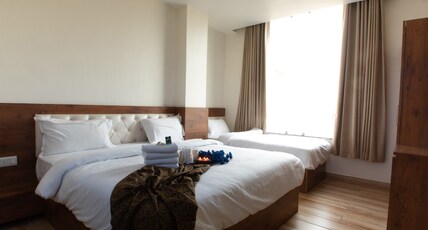 Hotel Aishwarya Room Type - Family Room with King Bed + Extra Bed