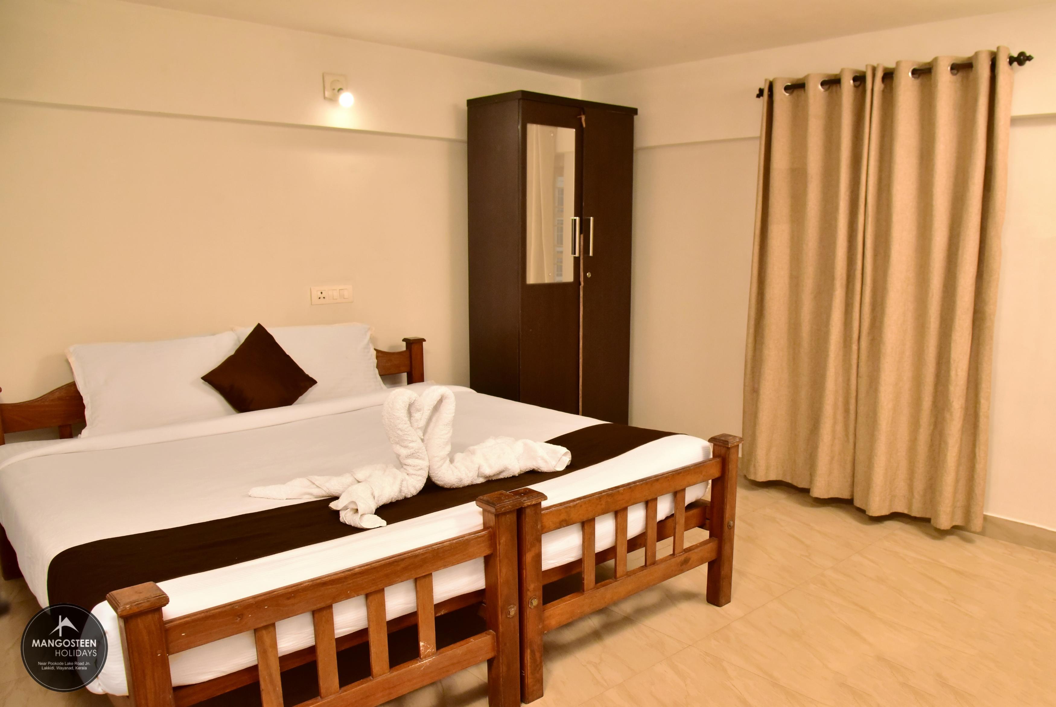 Mangosteen Holidays | Rooms & Caretaker - Tap to explore photos