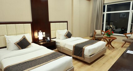Empire Stay , Amravati Room Type - Deluxe Twin Bed
