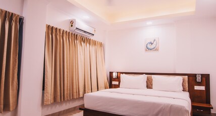 Mango Stayys | A Boutique Stay Room Type - Deluxe Suite with Balcony ( Garden View )