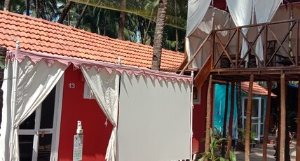 Art Resort Goa Room Type - SUPERIOR COTTAGE - PARTIAL SEAVIEW from varenda or high balcony in the 2nd or 3rd or 4th row after t