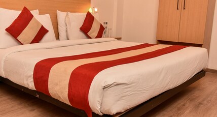 Hotel White Saffron Room Type - Deluxe Room with Free Wi-Fi and TV (Highly Preferred by Couple)