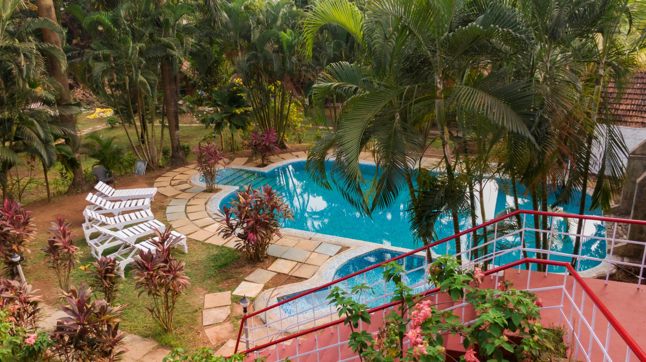 Tropical Valley Resort | Rooms & Pool - Tap to explore photos