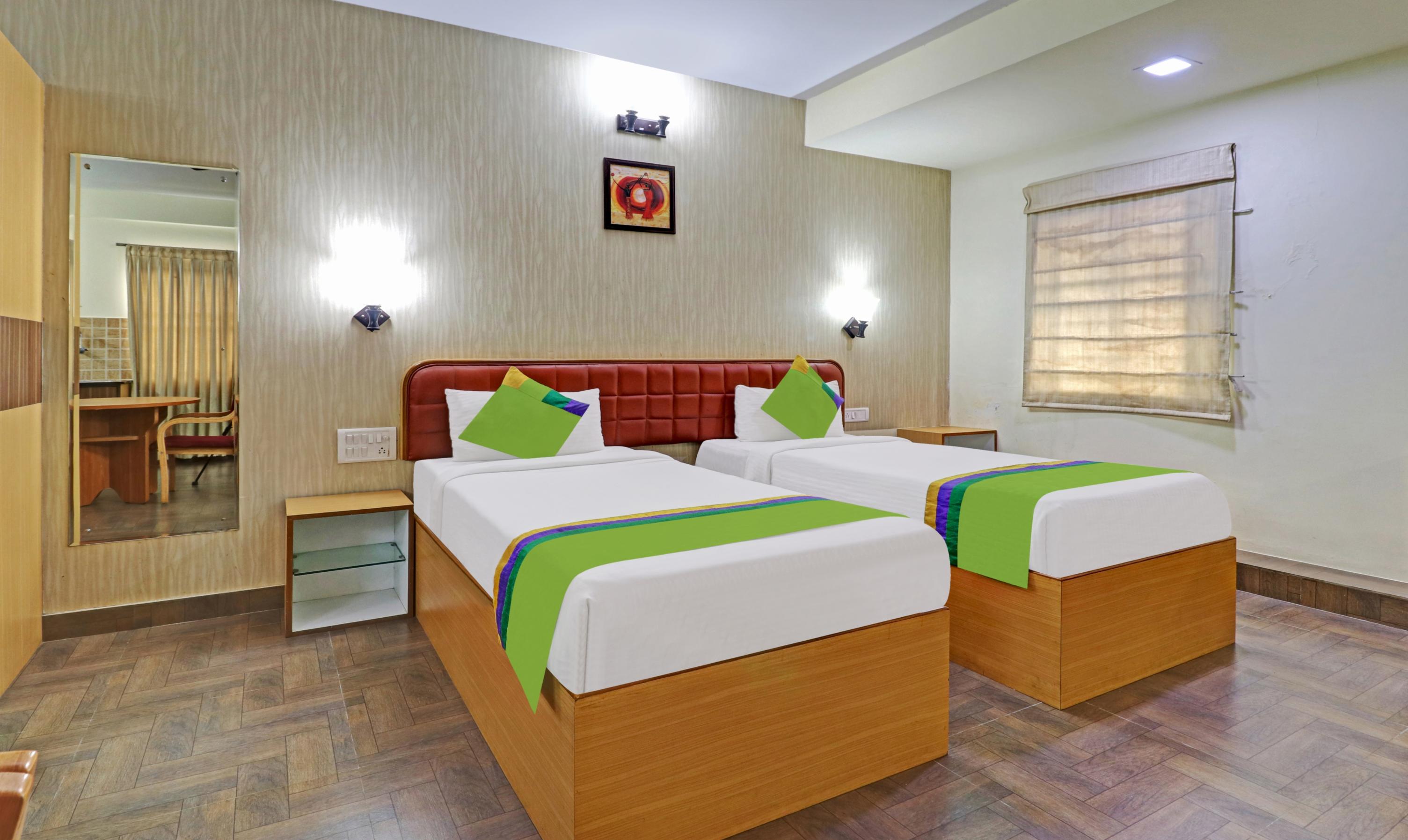 Treebo Akshaya Mayflower Vijaya Bank Layout - Tap to explore photos