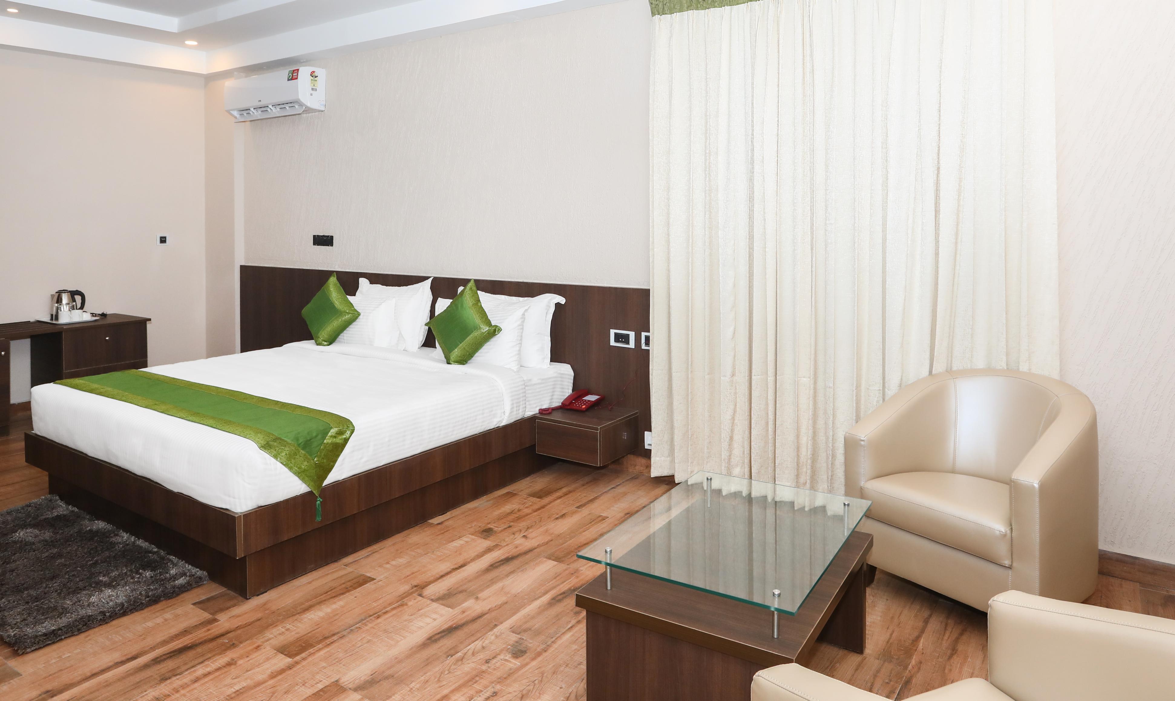 Treebo Durga Boji Grand, Gonikoppal Town Room Type - Spacious Premium Room