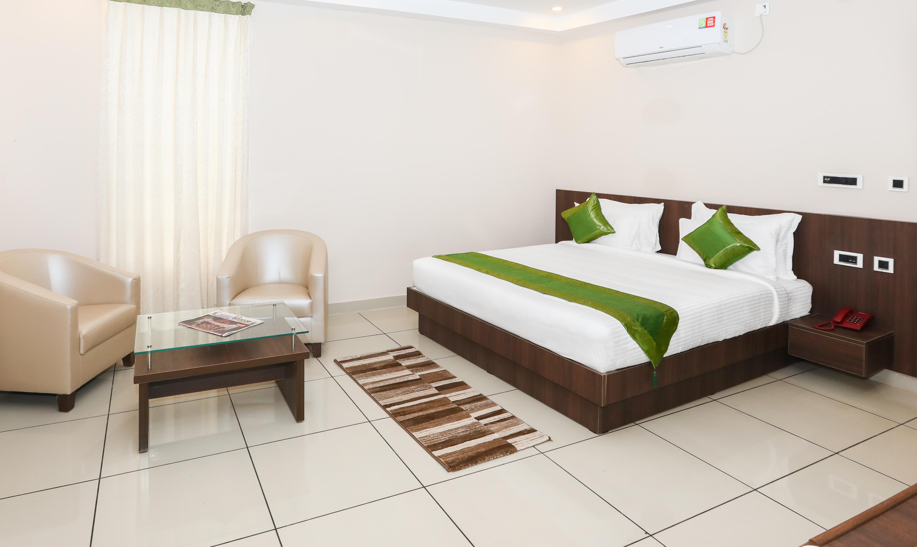 Treebo Durga Boji Grand, Gonikoppal Town Room Type - Deluxe Room
