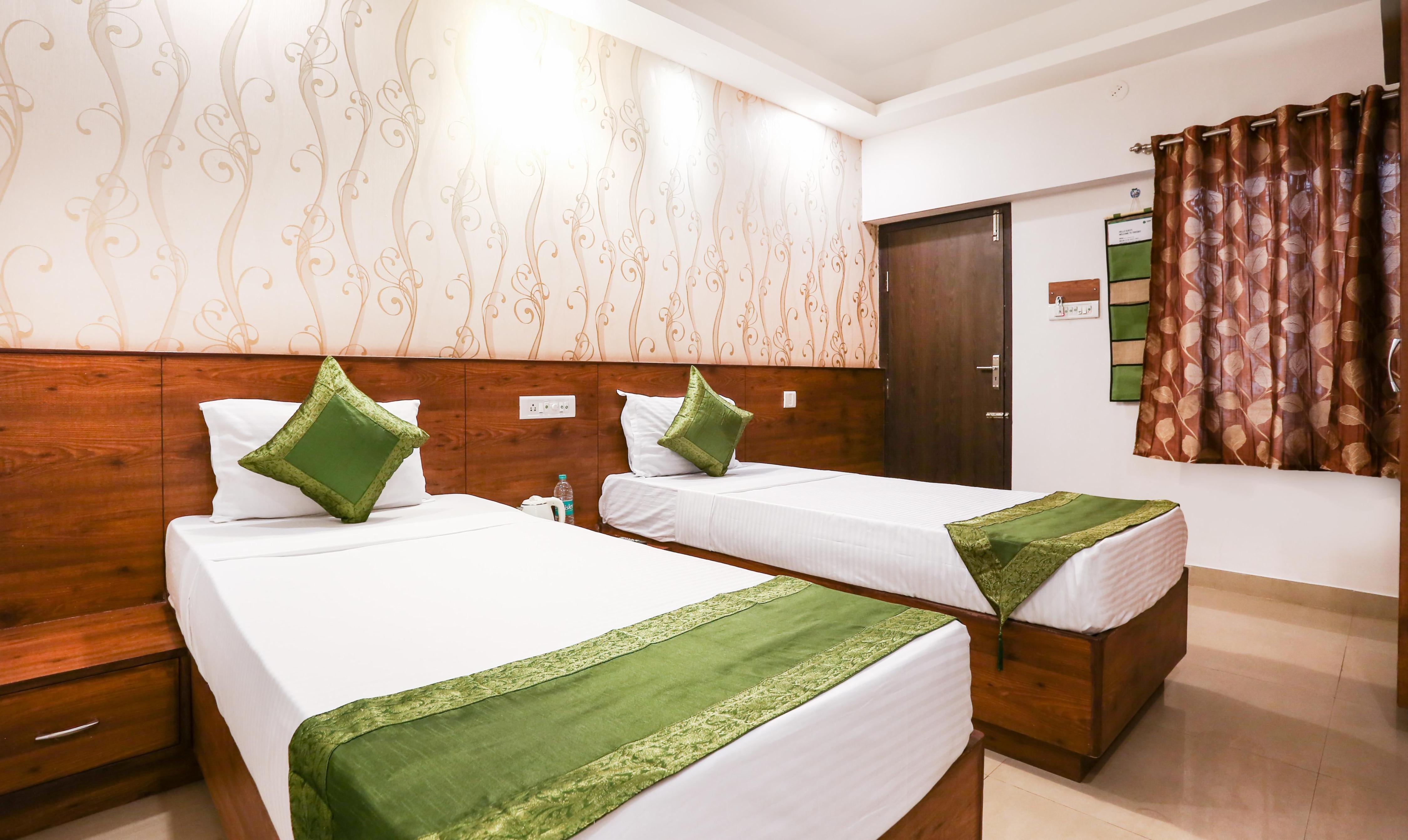 Treebo Comforts Inn, University Road Deralakatte Room Type - Standard Room With Queen Bed