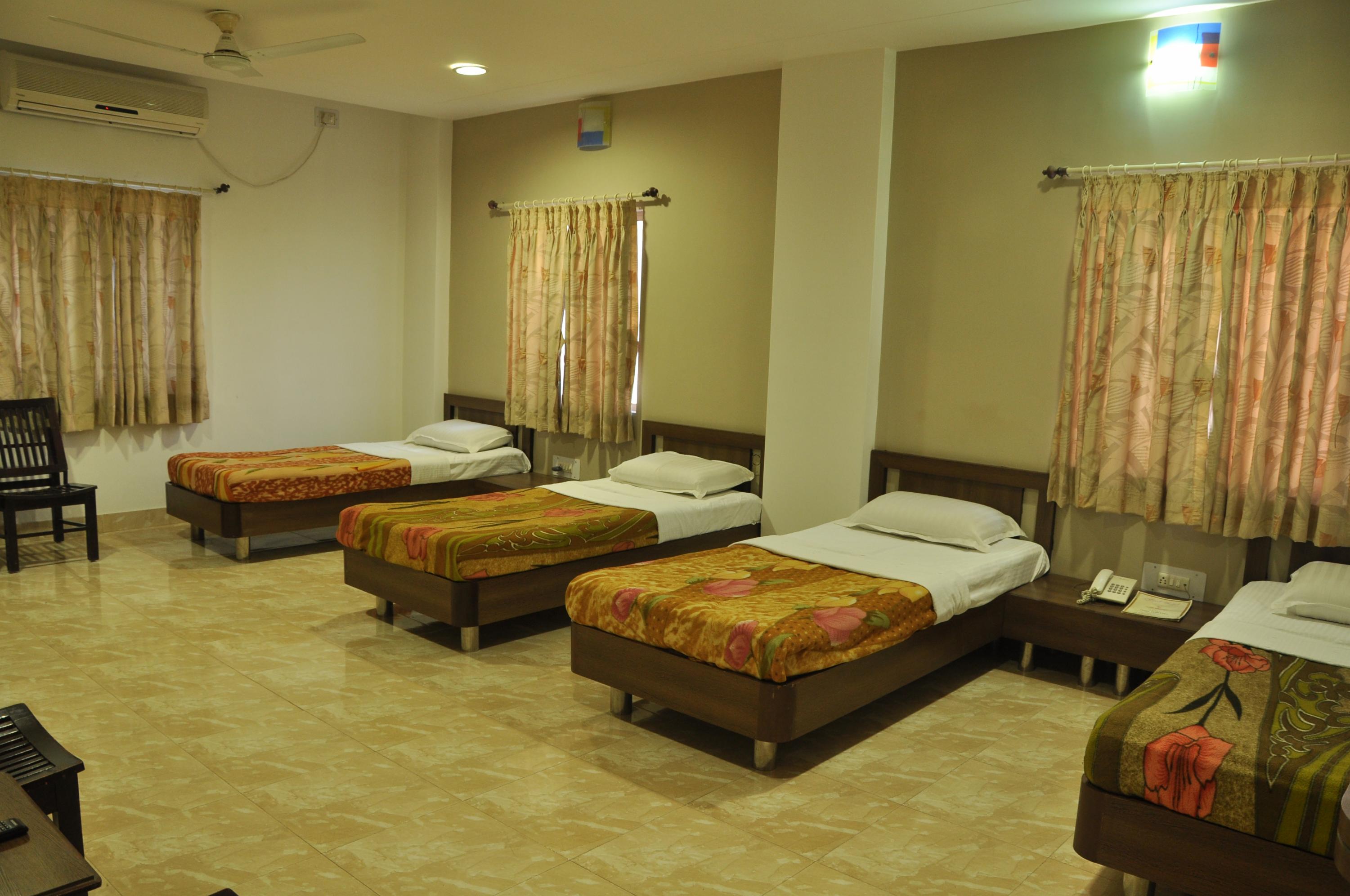 Hotel Prince Residency. Room Type - Family Room ( 4- Single Beds )