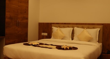 Girija Sunrise (300 Meter from Baba Dham Temple) Room Type - Premium Room