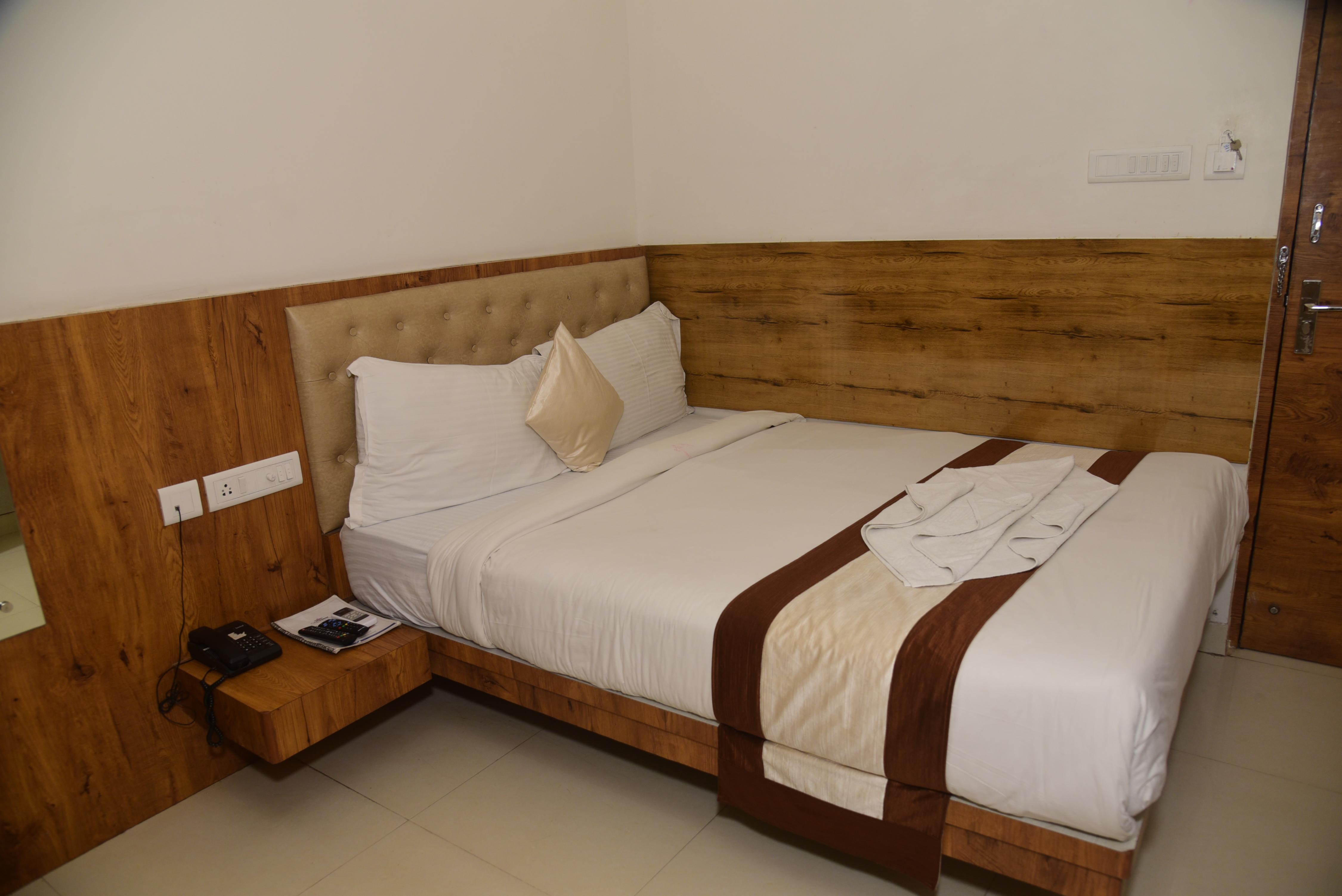Girija Sunrise (300 Meter from Baba Dham Temple) Room Type - Deluxe Room