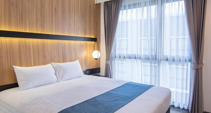 Gate43 airport hotel Room Type - Deluxe King room with pool view Gate43 airport hotel Room Type - Deluxe King room with pool view