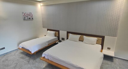 Hotel Riverfront-Pure Veg Room Type - 3 Bedded Premium Riverview Family Room