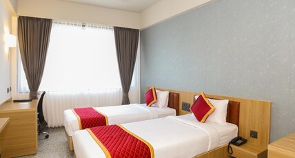 Icon Express by Bhagini Room Type - Deluxe Twin Bedroom