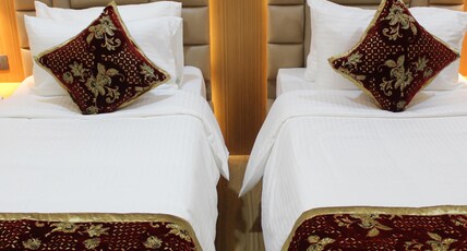 S R Continental Room Type - Deluxe Twin AC Room