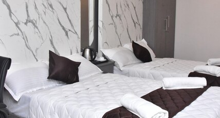 Sanns Tropicana. Room Type - Deluxe Twin Double Bed
