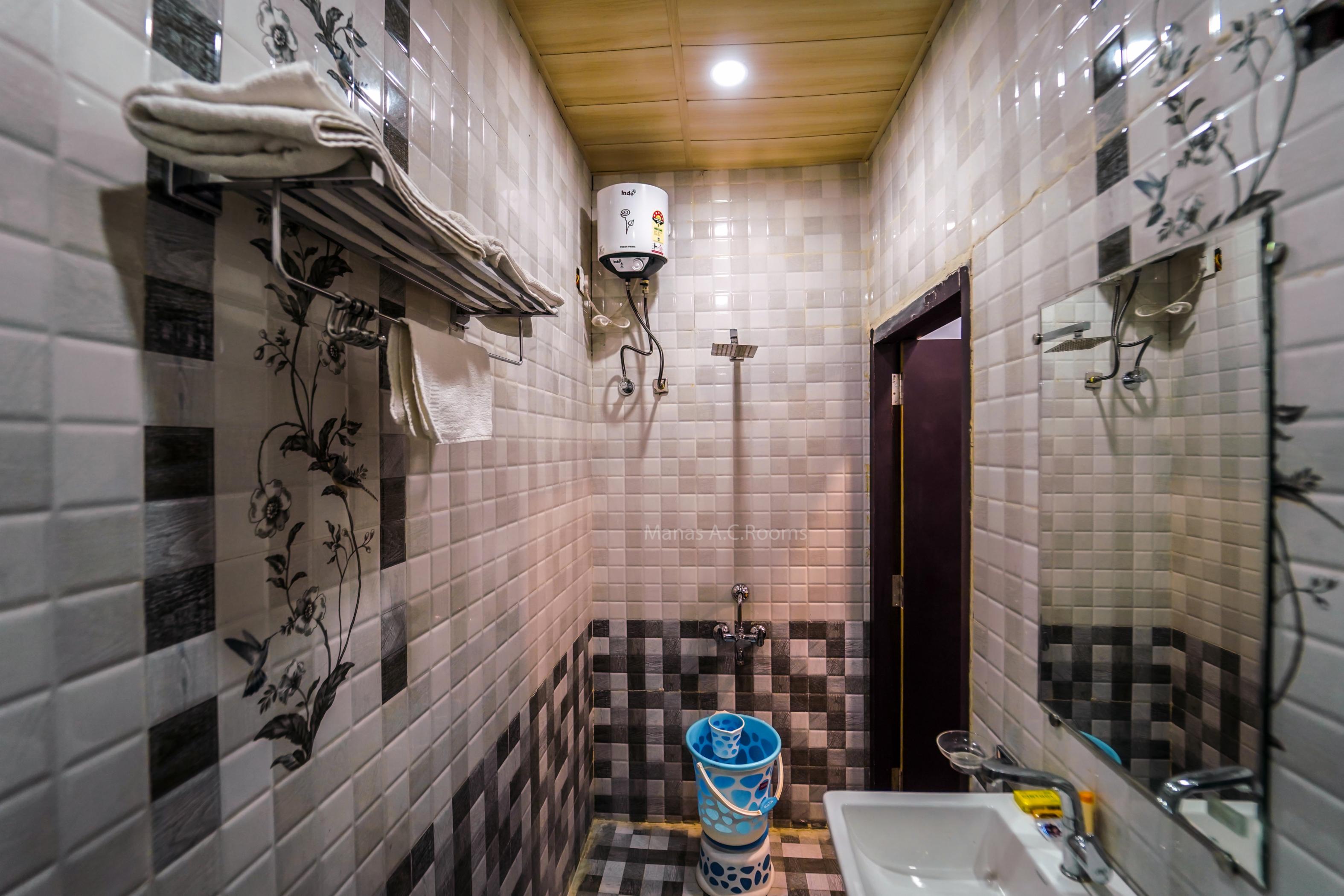 Manas AC Rooms - Tap to explore photos