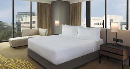 Hilton Bengaluru Embassy Manyata Business Park Room Type - King One Bedroom Suite with 2 way Airport Transfers, 2Pcs Laundry, Lounge Access