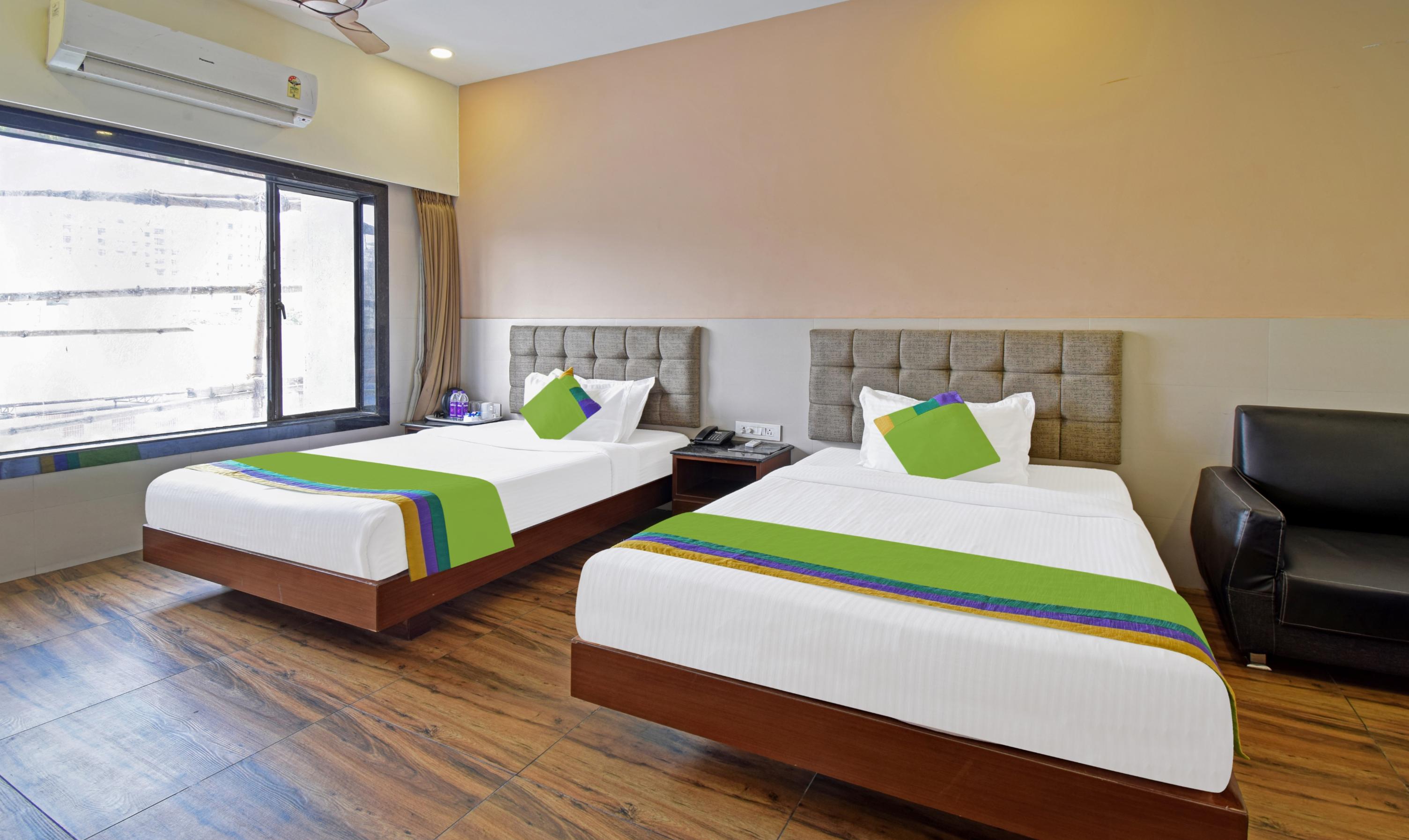 Treebo Sky Point Room Type - Deluxe Family Room