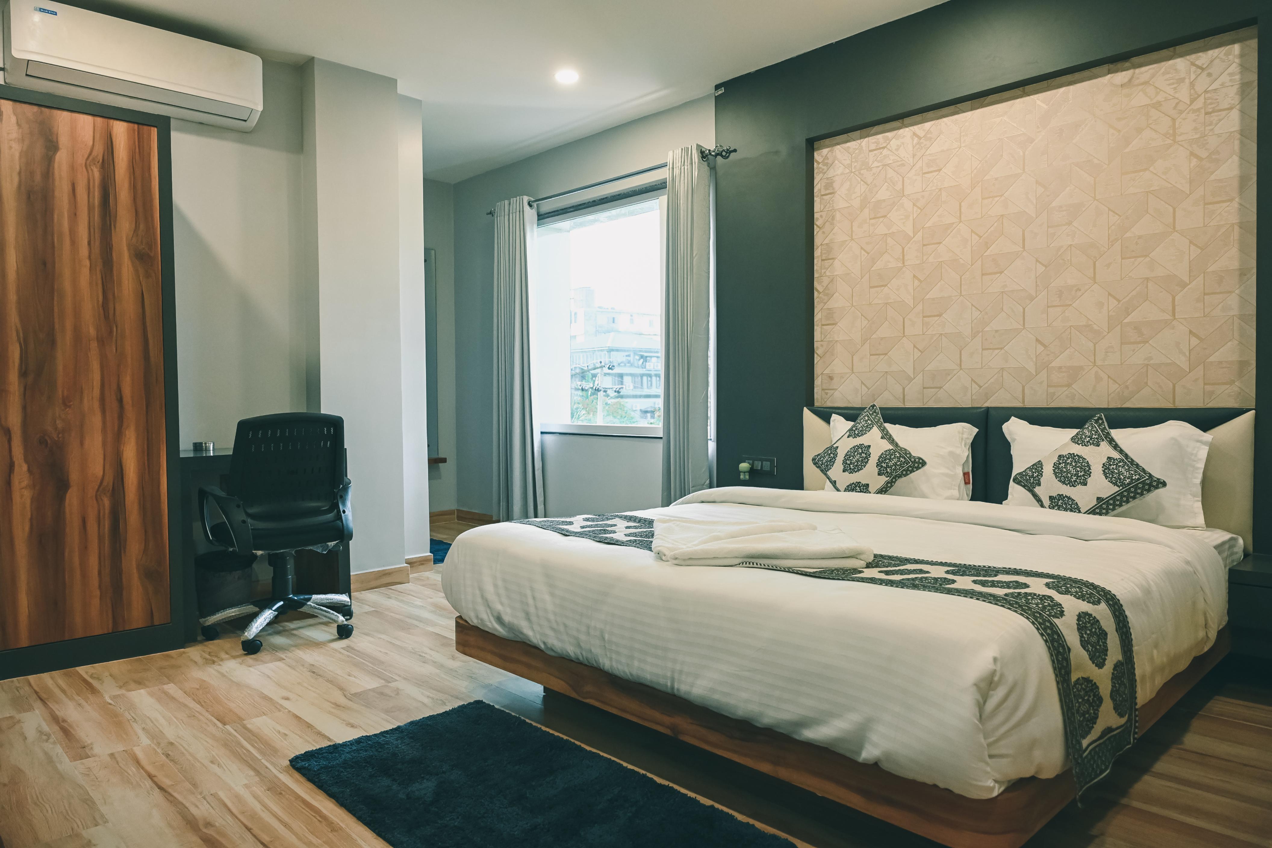 Empire Regency Room Type - Business Class (With Dining Table, Smart TV and Road Side view)