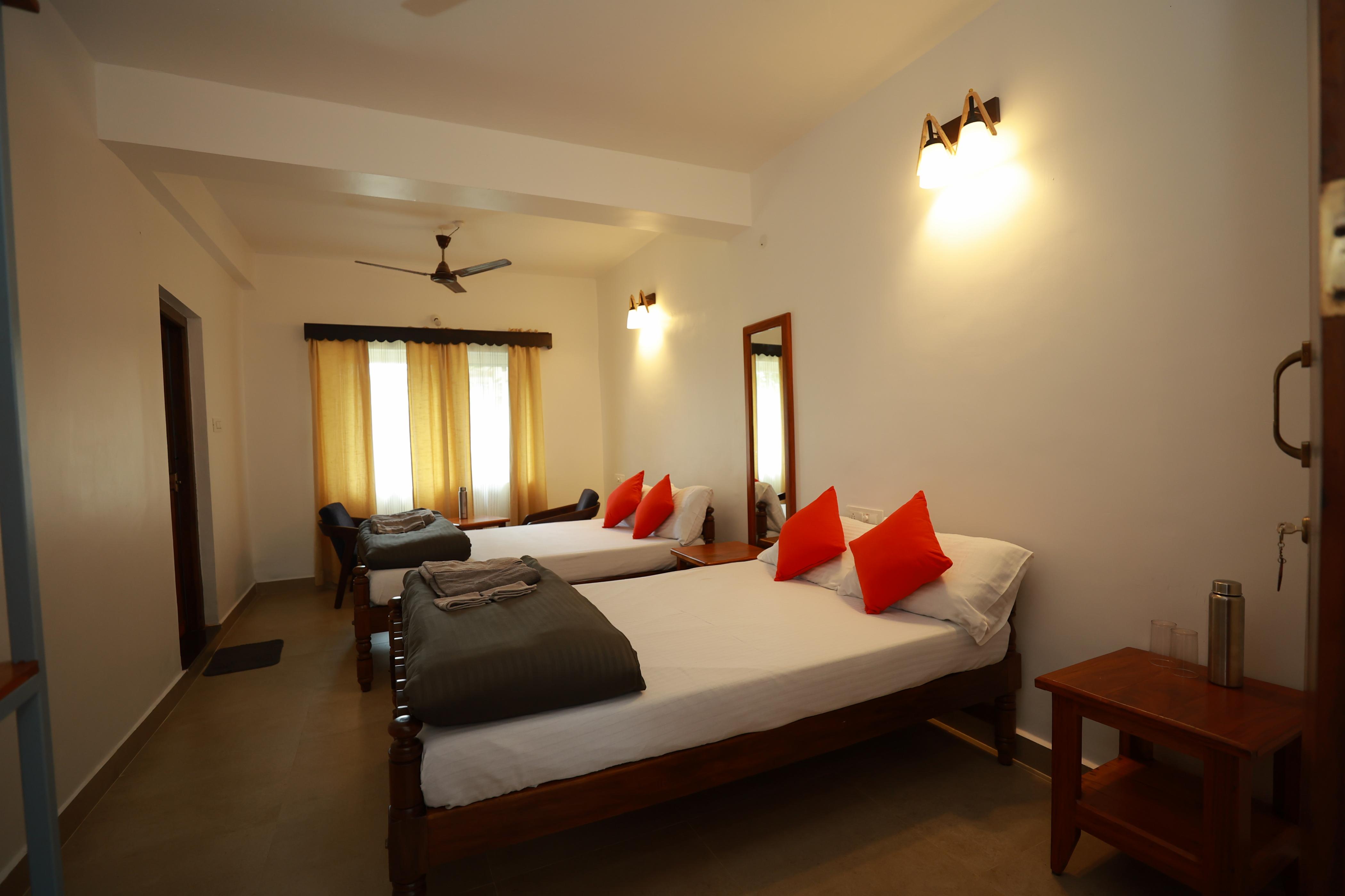 Ayla Homestay Room Type - Family Room (Premium AC) 2 Queen Cots