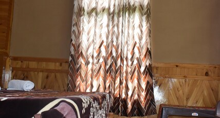 Jibhi Trout Homestay Room Type - BROWN TROUT DELUXE ROOM