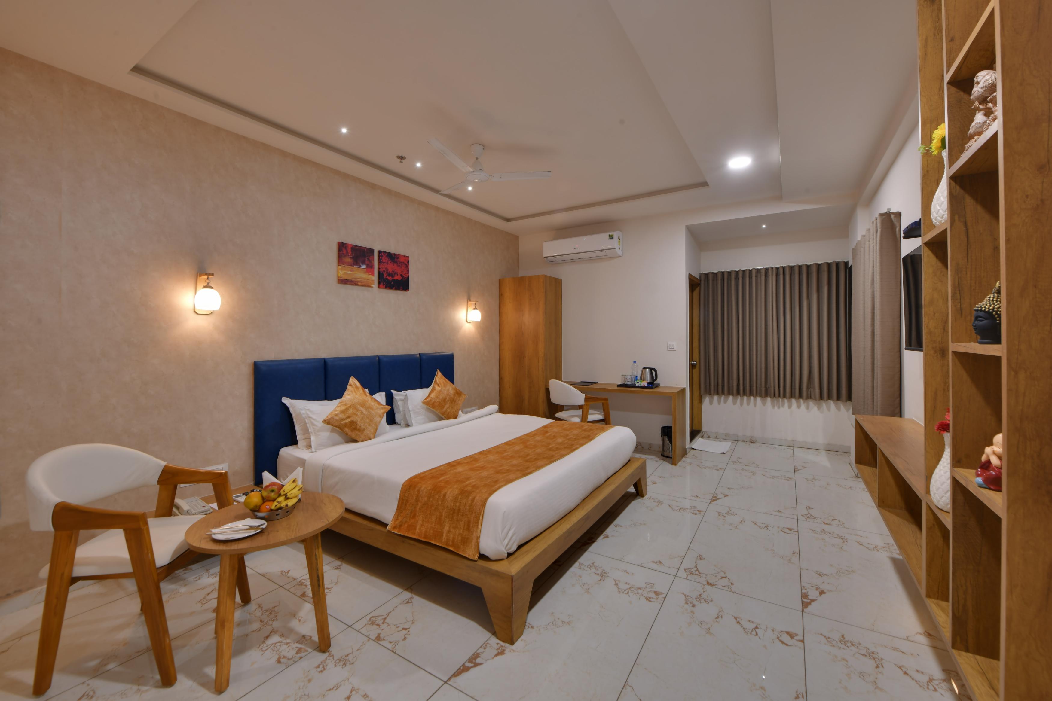 Click Hotel Tulsi - Tap to explore photos