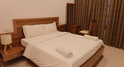 Hotel OPM INN Payyannur Room Type - Deluxe Room