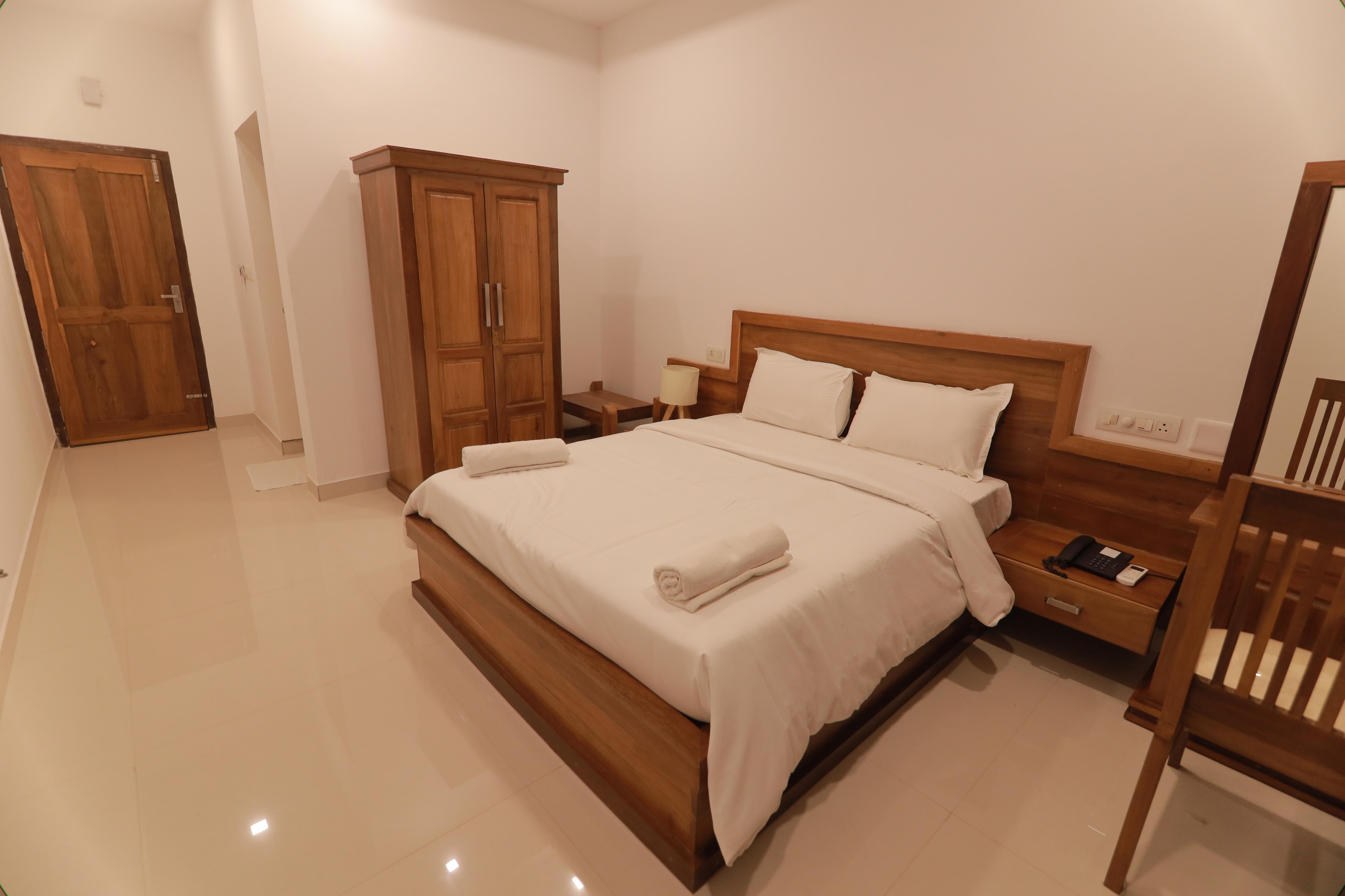 Hotel OPM INN Payyannur - Tap to explore photos