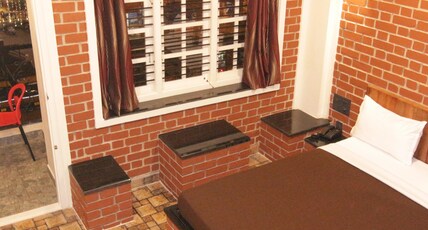 RED BRICKS INN Room Type - DELUXE ROOM NON AC