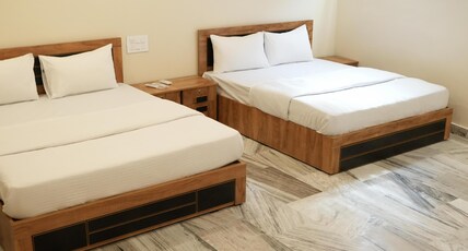 kalanad residency and convention centre Room Type - Super Deluxe Four Bedded Room AC (4 Adults)