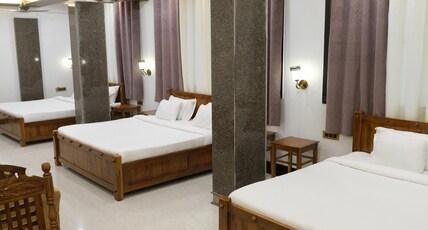 HOTEL DADAGURU FOREST INN, BAIHAR, KANHA NATIONAL PARK, MUKKI GATE. Room Type - Deluxe Room triple Bed HOTEL DADAGURU FOREST INN, BAIHAR, KANHA NATIONAL PARK, MUKKI GATE. Room Type - Deluxe Room triple Bed