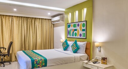 Treebo Premium Metropolis Room Type - Spacious Mahogany Room with Living Area