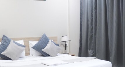 Staybia Hotels & Service Apartment Room Type - Luxury King Room with Balcony and Pantry Area