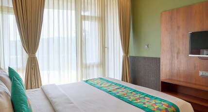 Treebo Sky Vista Suites with Hill View Room Type - Deluxe Room With Mountain View