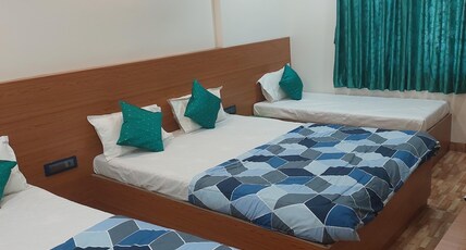 Hotel Sai Dakshina Inn Room Type - Economy 5 bedded Room (Ac) Hotel Sai Dakshina Inn Room Type - Economy 5 bedded Room (Ac)