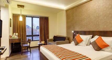 Regenta Place Raysons Kolhapur Room Type - Deluxe Queen Room