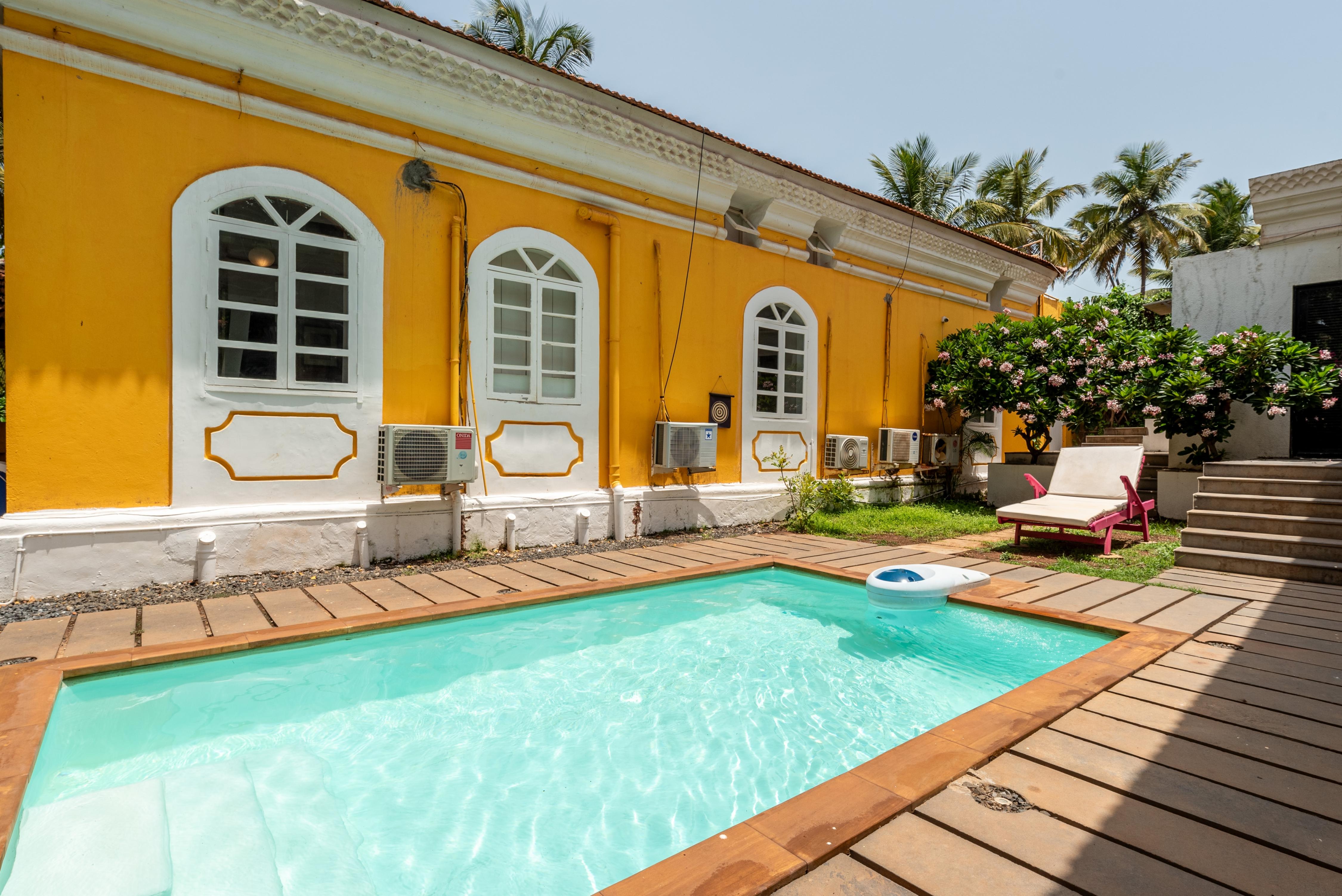 Eden 5BHK Portuguese villa with pool by Roamhome - Tap to explore photos