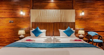 Shanthi Kunnj Riverside Exotica Room Type - Log House with a private balcony and River view Shanthi Kunnj Riverside Exotica Room Type - Log House with a private balcony and River view