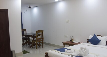 Maa Gouri Guest House Room Type - Deluxe room with Bath tub and dining table