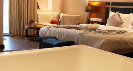 Boutique Stay w Private Jacuzzi | Belmore Hospitality Room Type - Bedroom 1