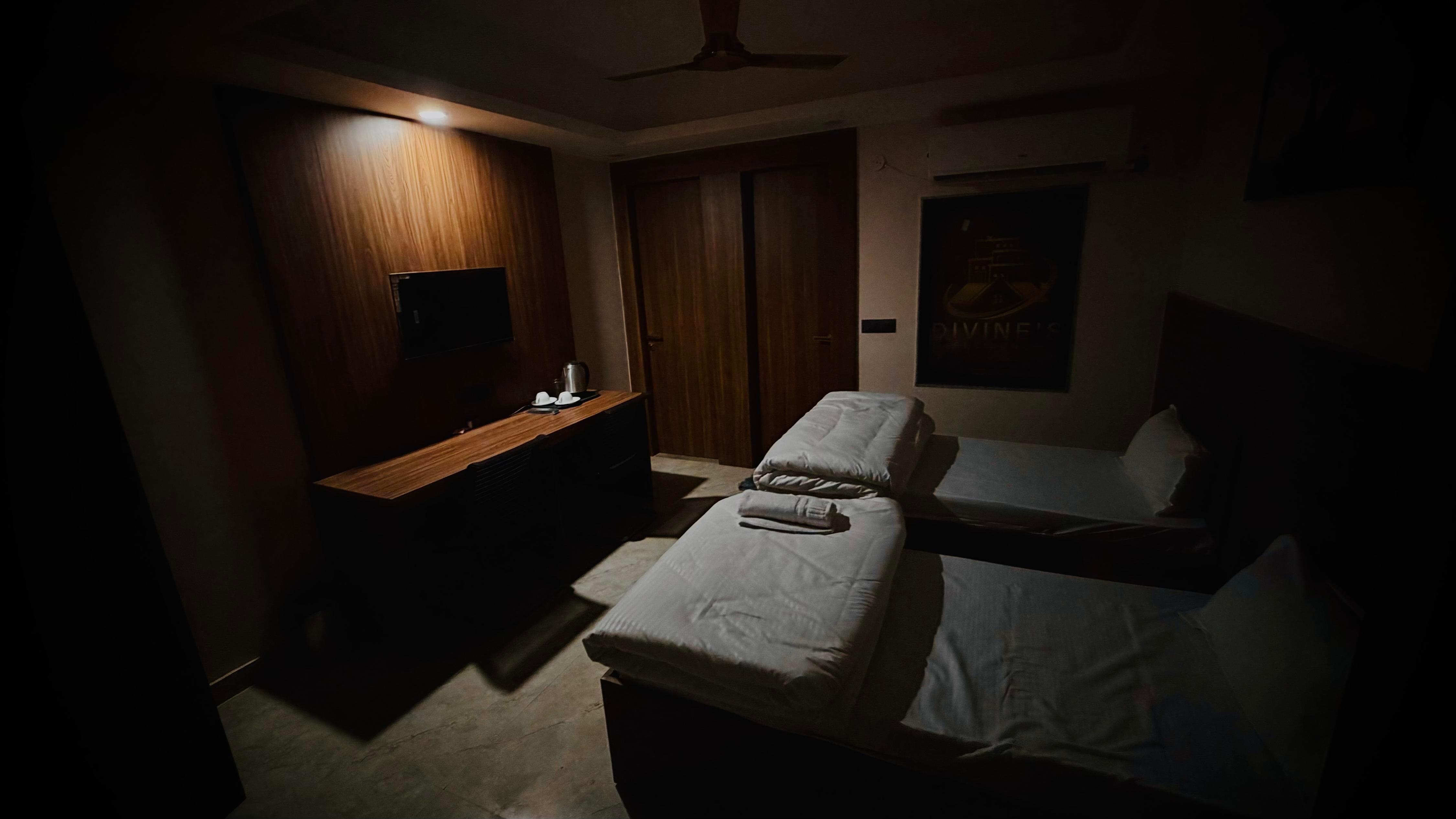 Hotel Divines Residency - Tap to explore photos