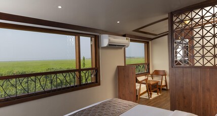 Kadavil Luxury Houseboat by Riverine Group Room Type - Deluxe Sharing Cruise (AC only at Night time) Kadavil Luxury Houseboat by Riverine Group Room Type - Deluxe Sharing Cruise (AC only at Night time)