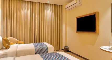 Palette Convention Hotel by CheckIn, Millennium City Gurugram Room Type - Deluxe Twin Room with Balcony