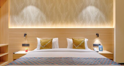 Palette Convention Hotel by CheckIn, Millennium City Gurugram Room Type - Deluxe King Room with Balcony