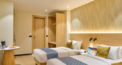 Palette Convention Hotel by CheckIn, Millennium City Gurugram Room Type - Premium Twin Room with Balcony